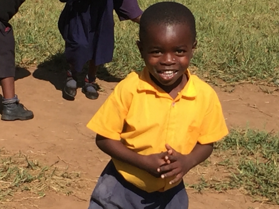 smiling boy in Liberty School uniform