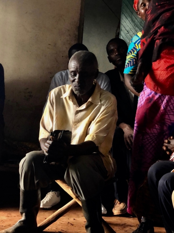 a man sitting in a group