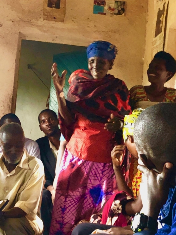 a woman talking to a group