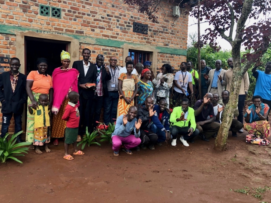 a group of 29 people posing for a photo