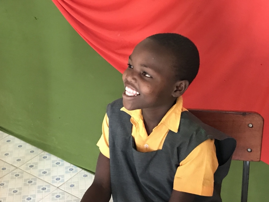 smiling boy in Liberty School uniform