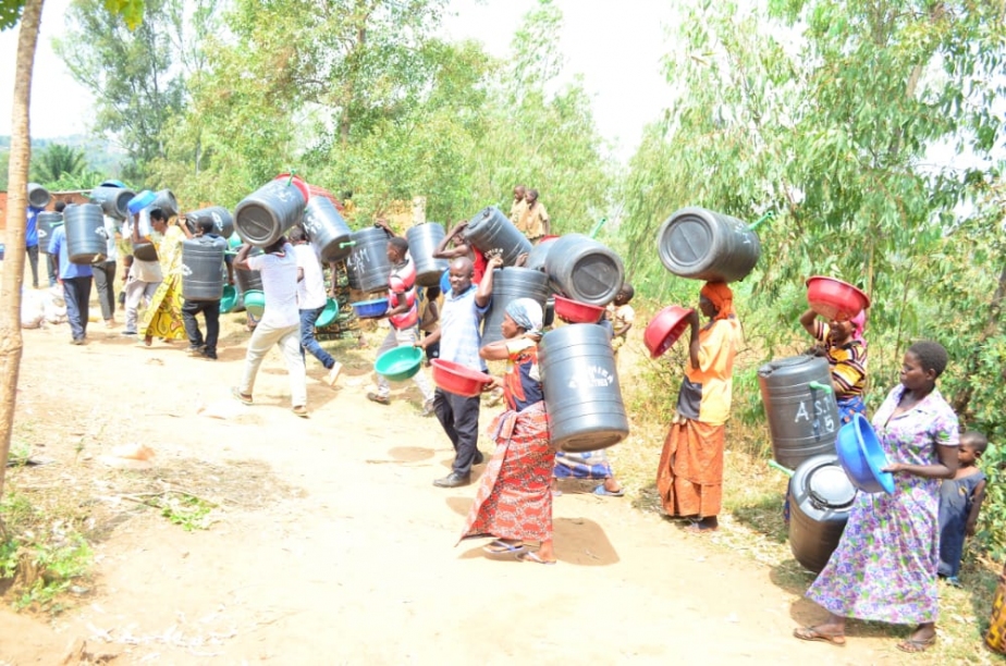 people carrying water filters
